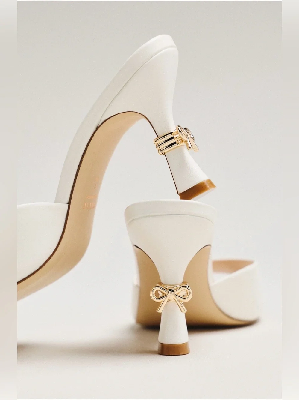 Maeve Metal Bow Open-Toe Mule Heels